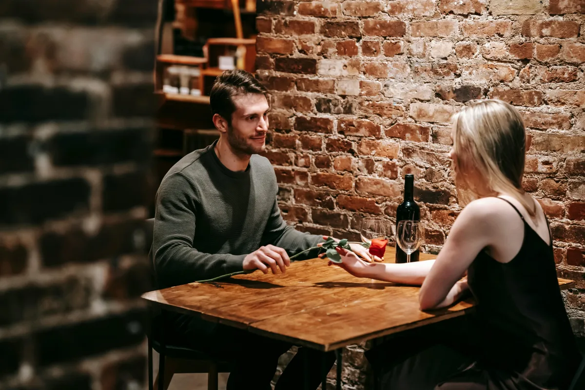 Networking event for singles — attendees mingling and exchanging contact details after a speed dating night